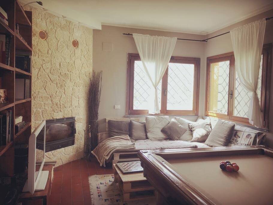 The dining room with the billiards and fireplace