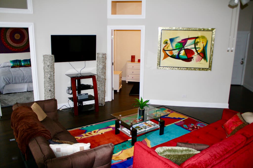 Get comfy in our colorful mood elevating living room with cable and wifi