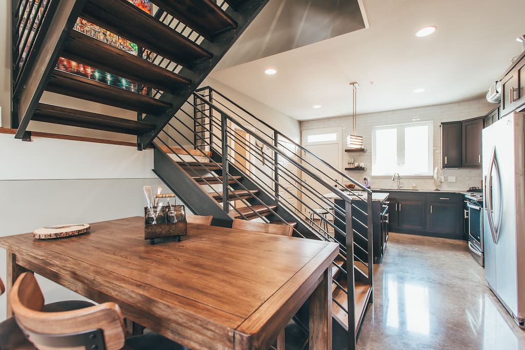 The dining area offers seating for 4 around the wood table