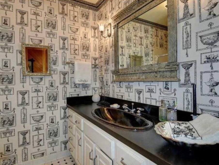 Private bath features large vanity and shower. Toiletries and towels provided.