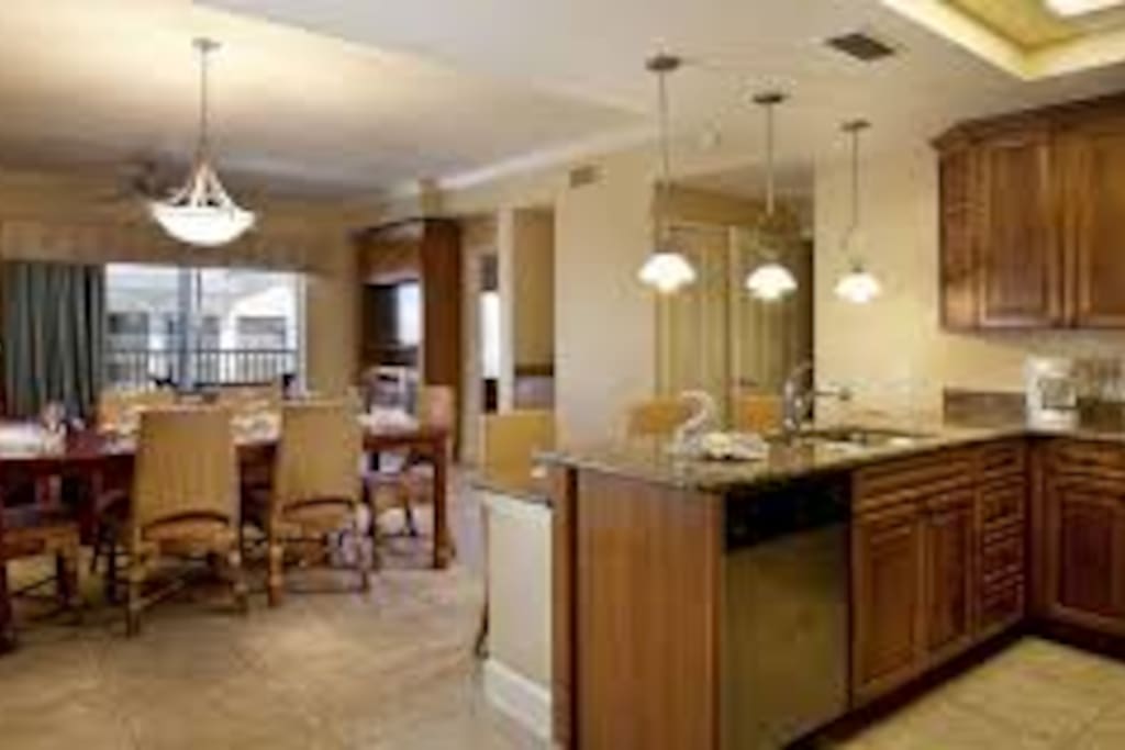 full kitchen with dining table