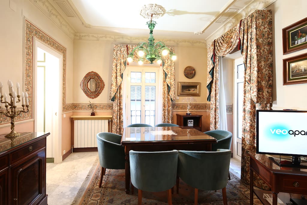 Dining area with table and 6 chairs.
