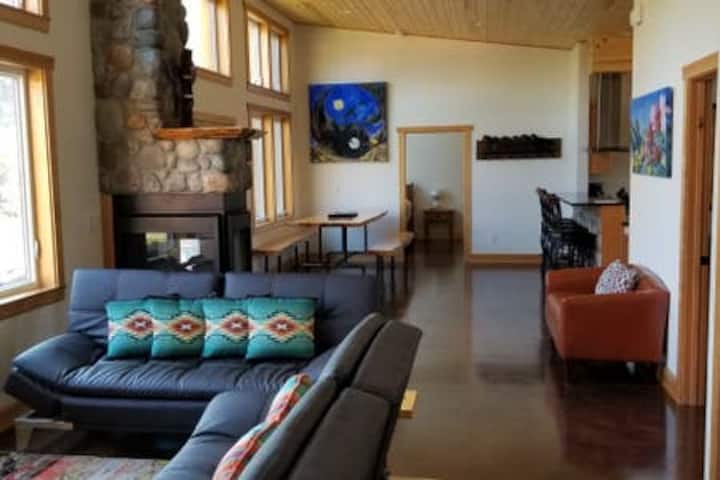 Futon folds down into a double bed. Open floor plan with views of the river.