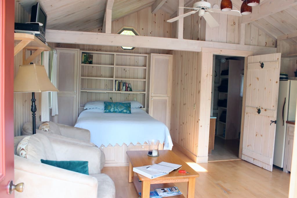 Queen bed in living area