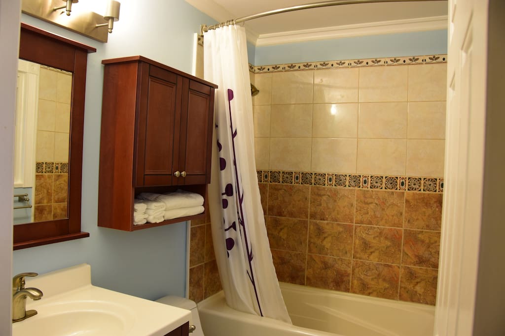Private bathroom with bathtub, all essentials included (shampoo, towels, hairdryer, cups, iron, etc.)