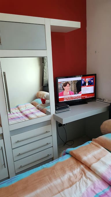 32" Panasonic Full HD TV & strong signal Hi speed Wifi inside the room, with desk for your laptop + DVD player for complete entertainment.