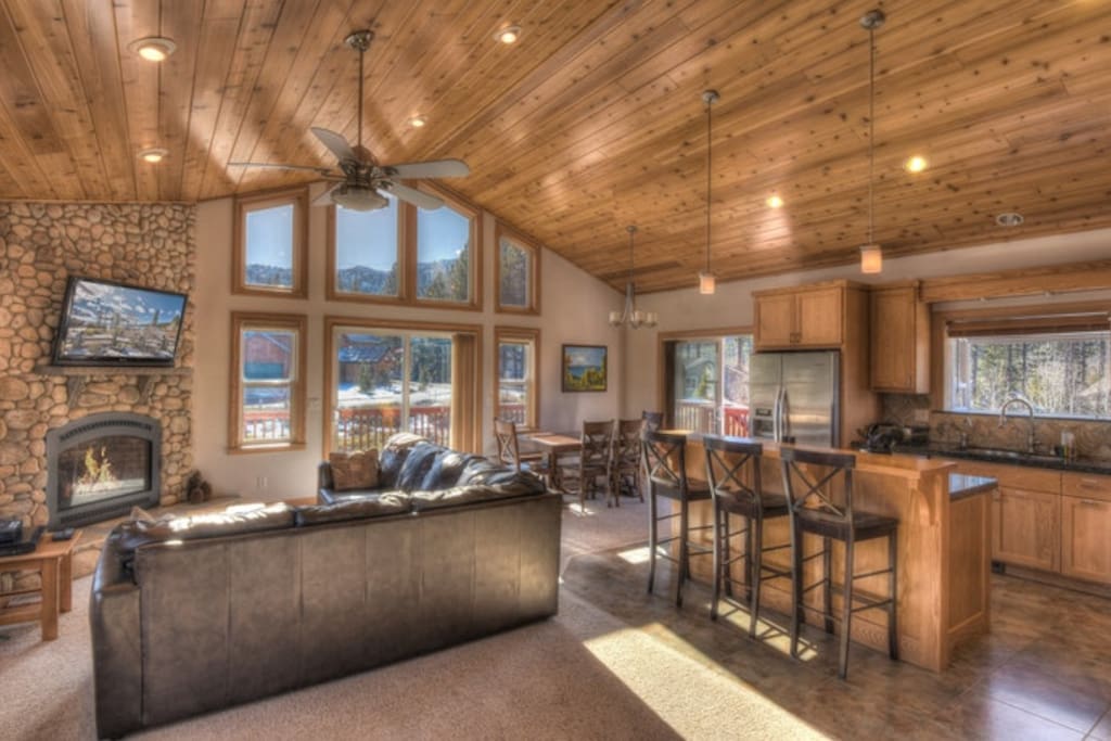 High ceilings and wraparound couch family room