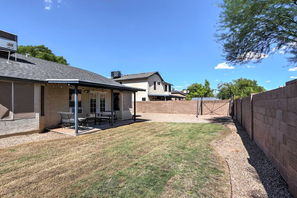 The home features a large backyard with a private patio.