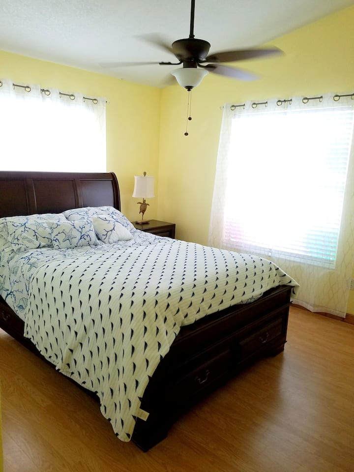 Bedroom 1 features a queen sized bed and Roku TV.