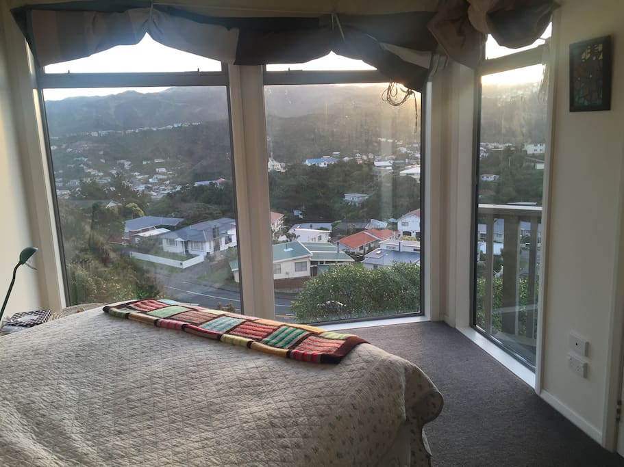 Amazing views from bedroom number 1. A cosy, tidy space with bedside tables.