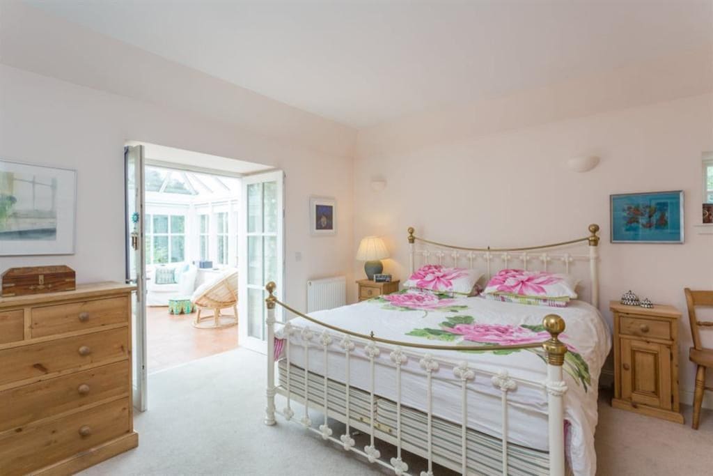 Super king bedroom leading to conservatory