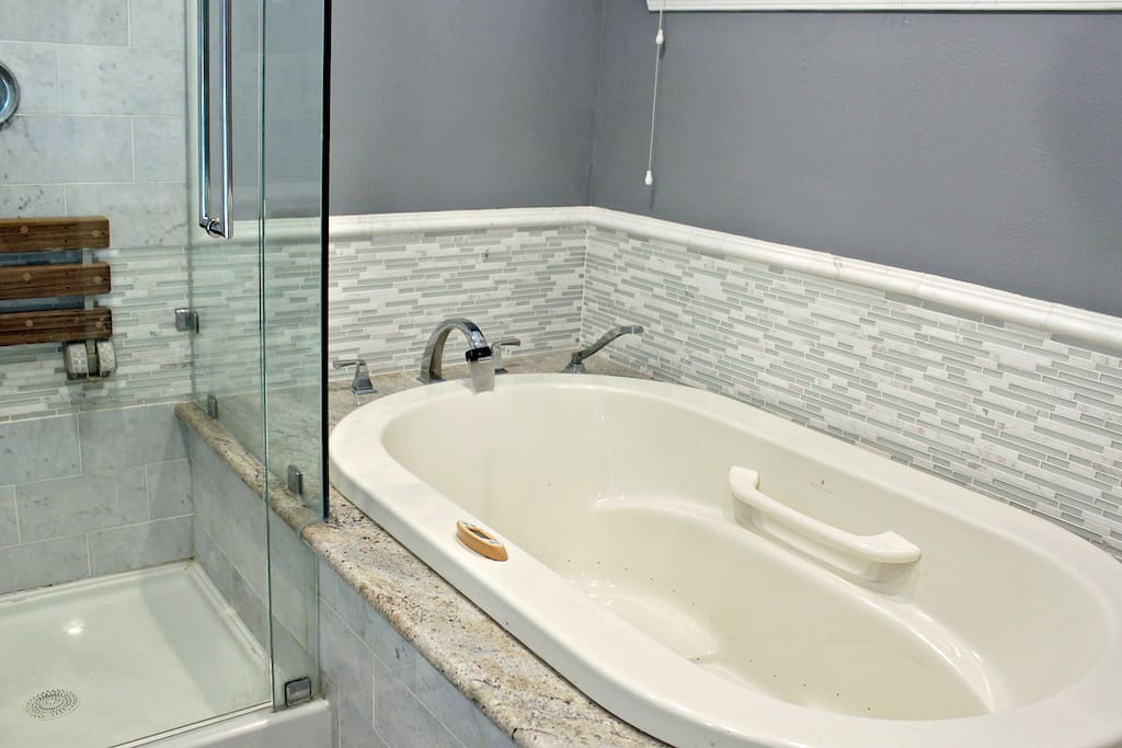 Relax in a hot tub after a long day. No jets though as it's faulty.