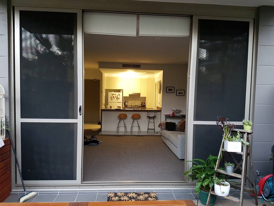 Courtyard looking into lounge with large sliding doors