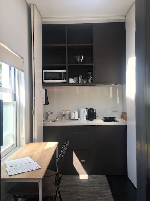 Dishwasher, fridge, hob, sink.