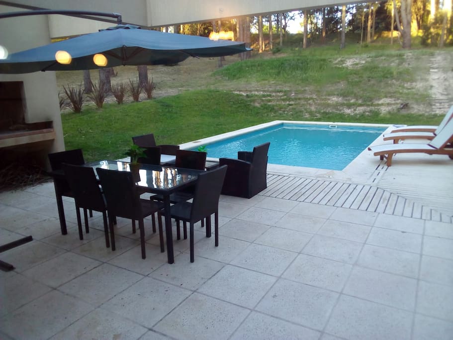 View from sliding door out to pool & barbeque