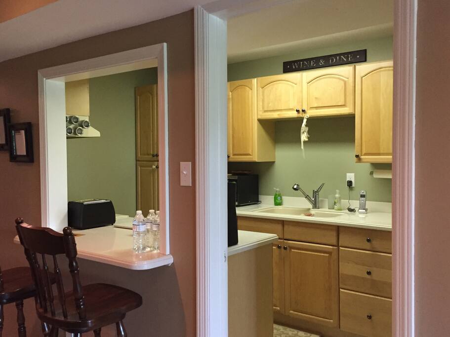 Full kitchen with breakfast bar for two