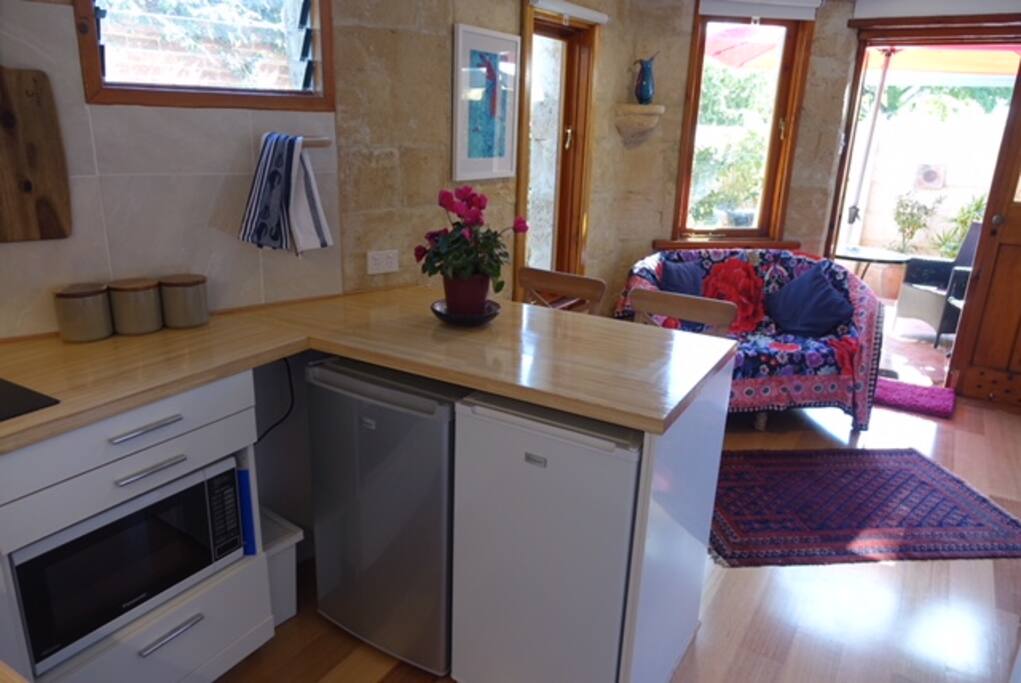 View from kitchen through living area to courtyard garden