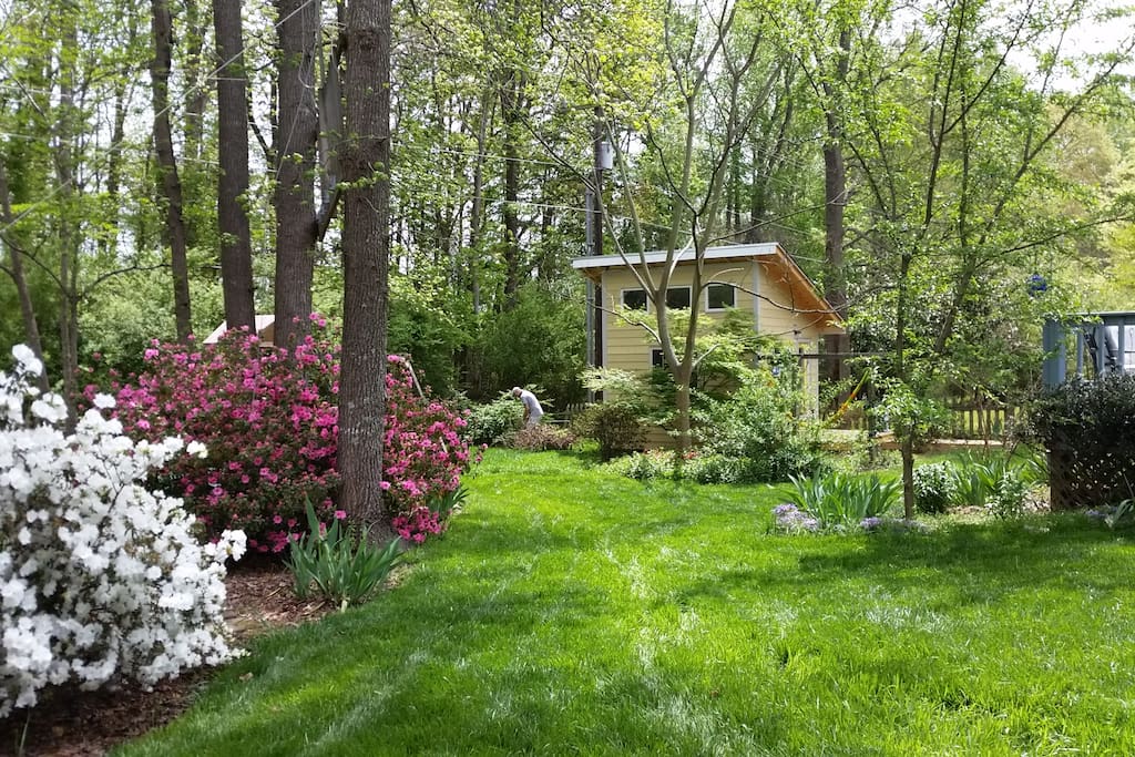 The serene private backyard is fenced, adjoining a church property owned woods.