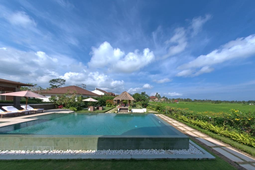 Private pool with rice field view