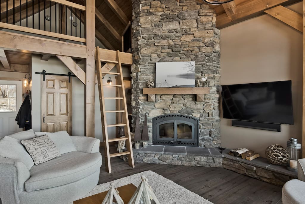 Wood burning fireplace and ladder to loft