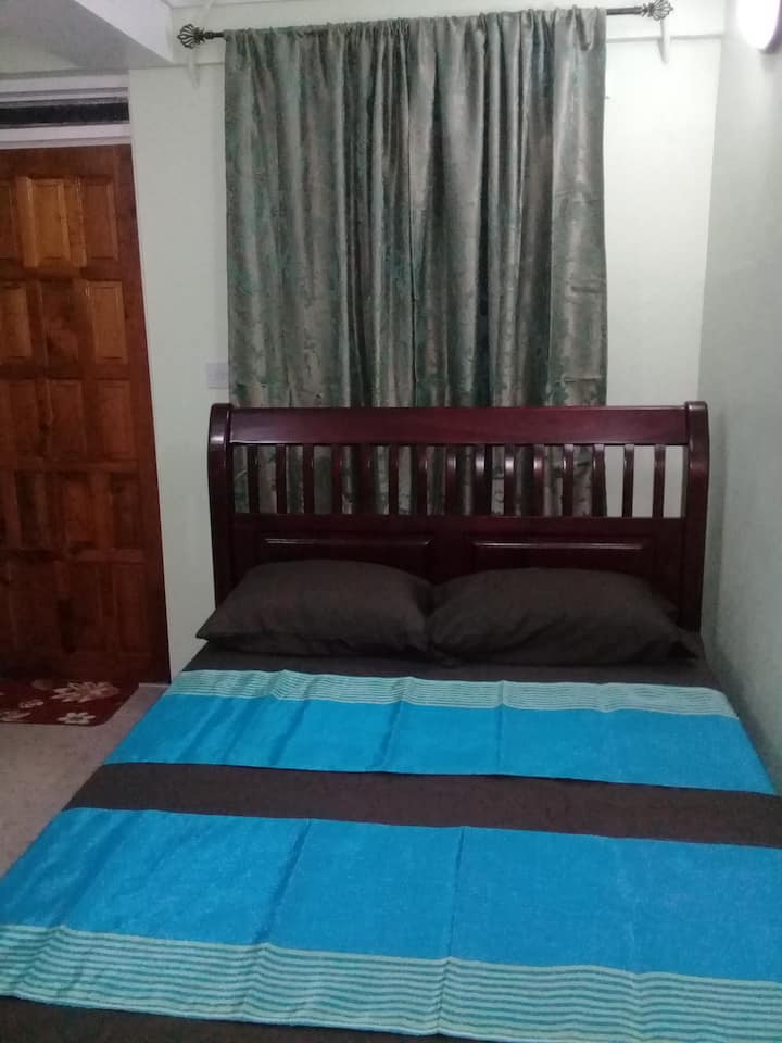 Bedroom - After a long day exploring Dominica or doing business, fall asleep in comfort.