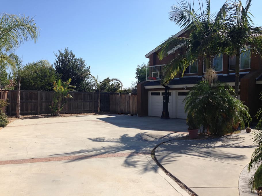 Driveway, with basketball and room for parking.