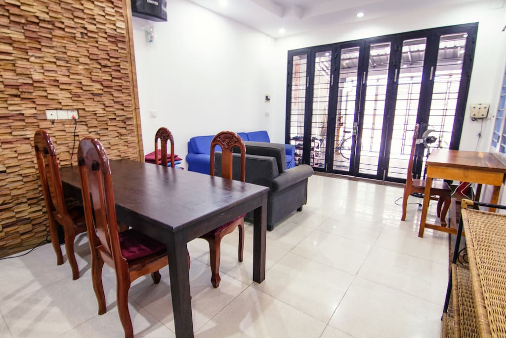 Ground floor living room with a couch and dining table