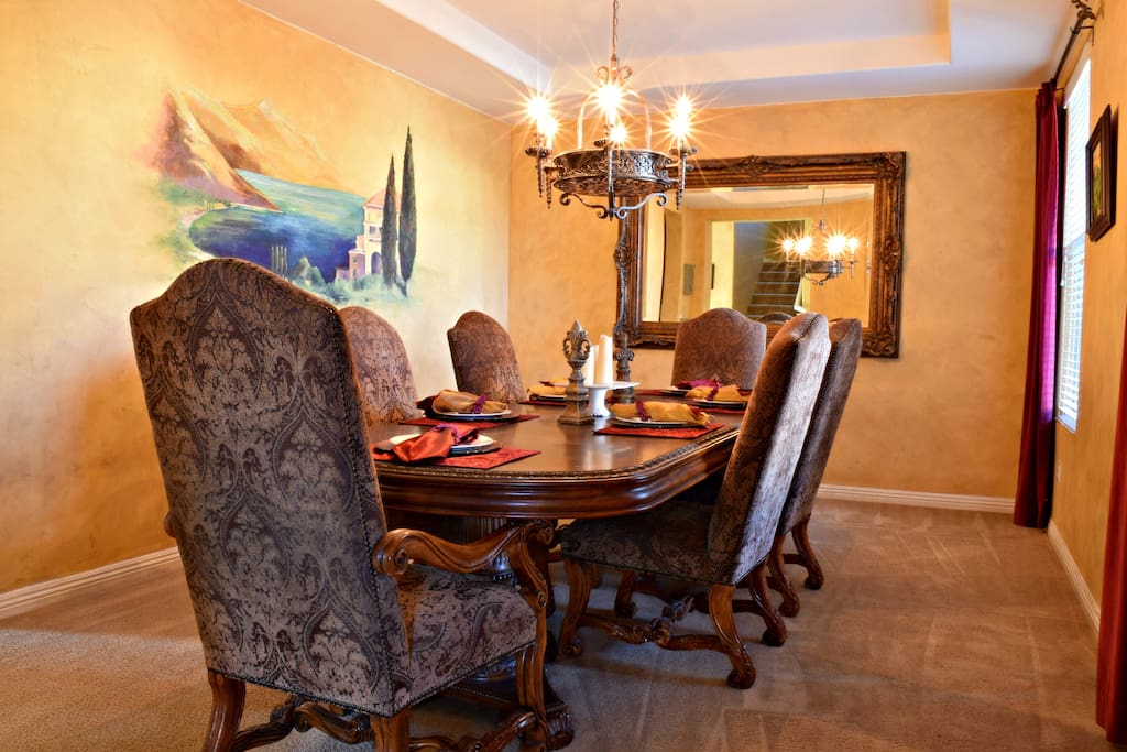 View of the Formal Dining room with a table that seats 10 guest comfortably.