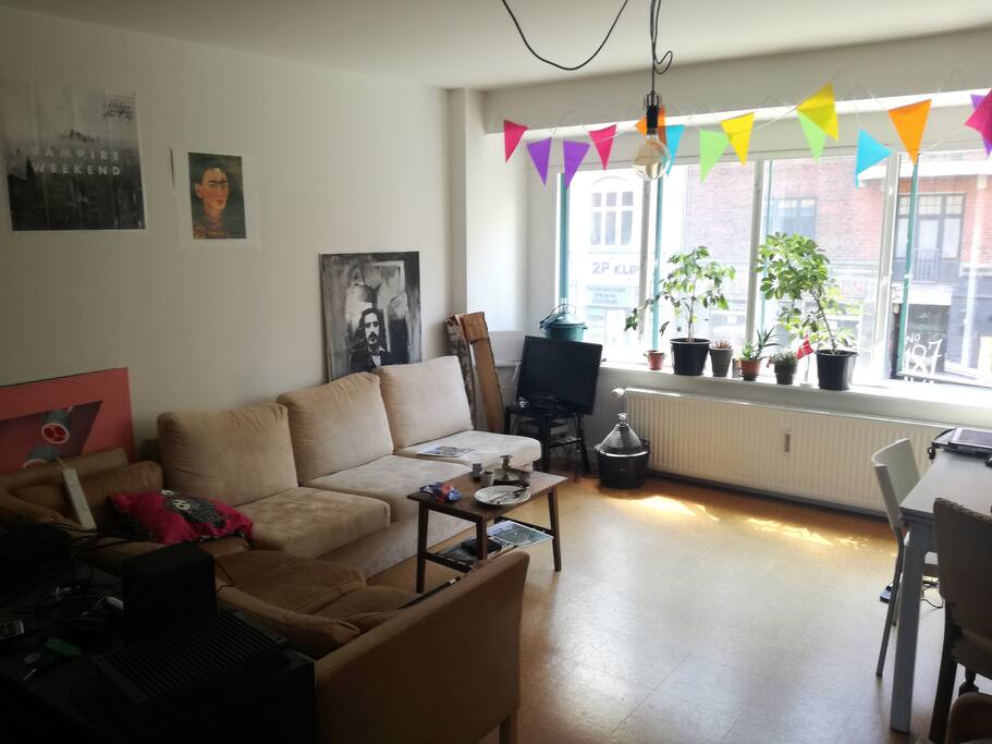 This is our spacious living room. You can hang out here, rest on our comfortable couch, play some video games or eat your dinner at one of our dining tables.