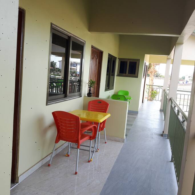 The balcony in front of the rooms..