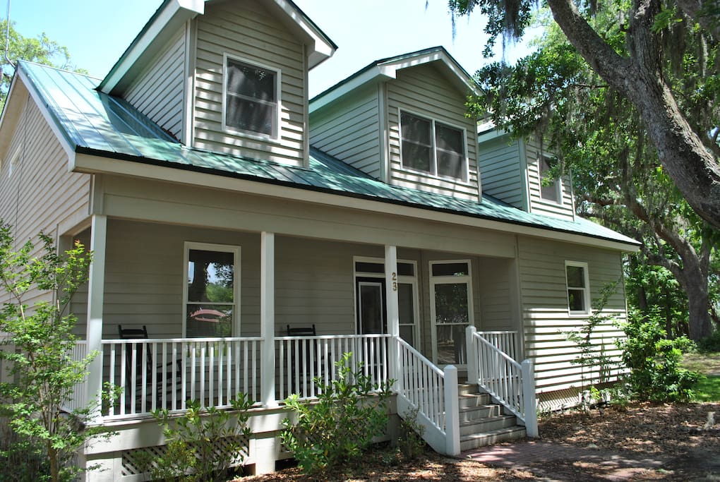 Front view of the cottage with parking for 2 cars in front of the cottage, and more parking nearby