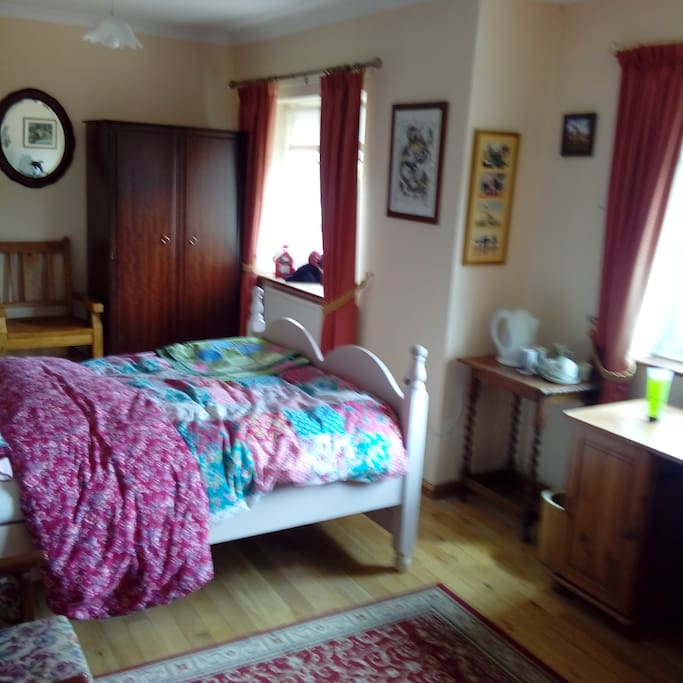 Bedroom with two windows and writing desk