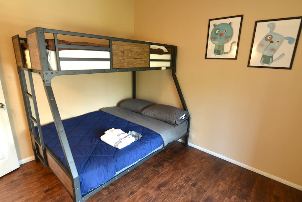 Bedroom equipped with two Super Comfy Mattresses with waterproof bed bug proof mattress covers.
