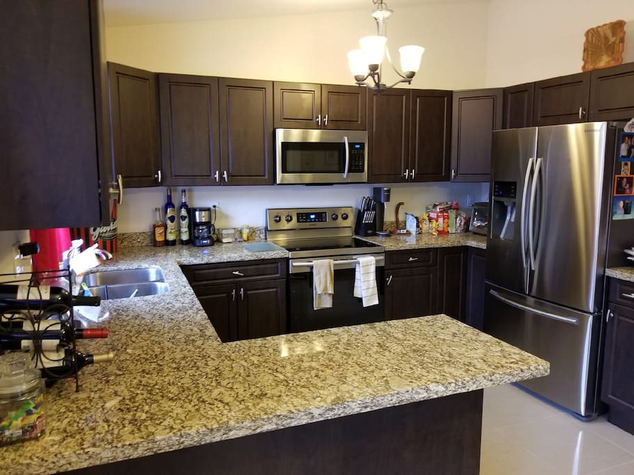 Kitchen with access to microwave oven and fridge.