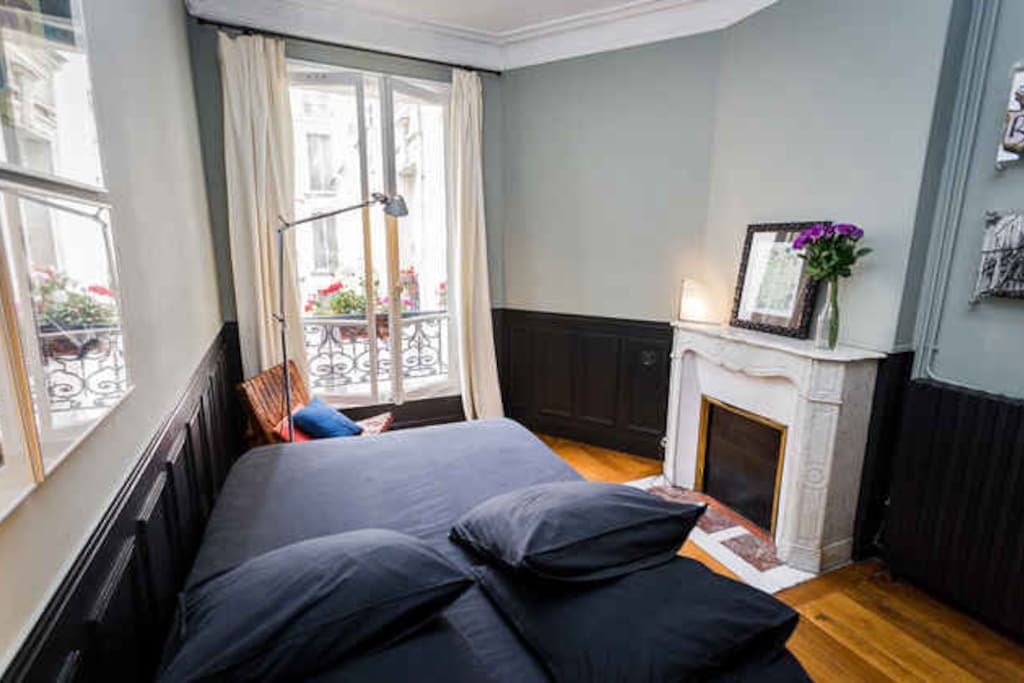 Bedroom with double bed and closets. It overlooks a private courtyard and not the street.