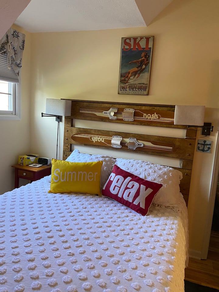 Recently redecorated bedroom with handmade water ski  queen headboard
