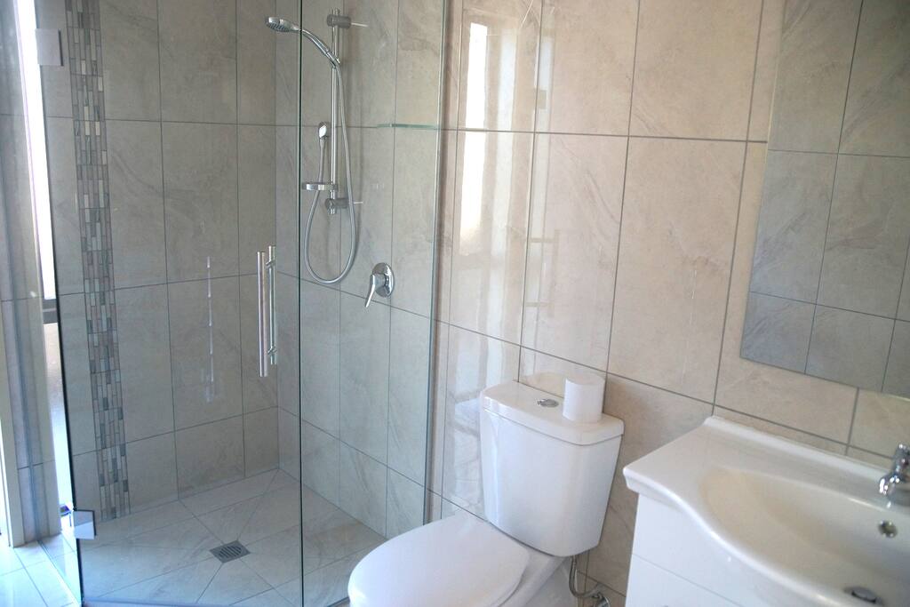 Ensuite bathroom for master bedroom with shower toilet and vanity