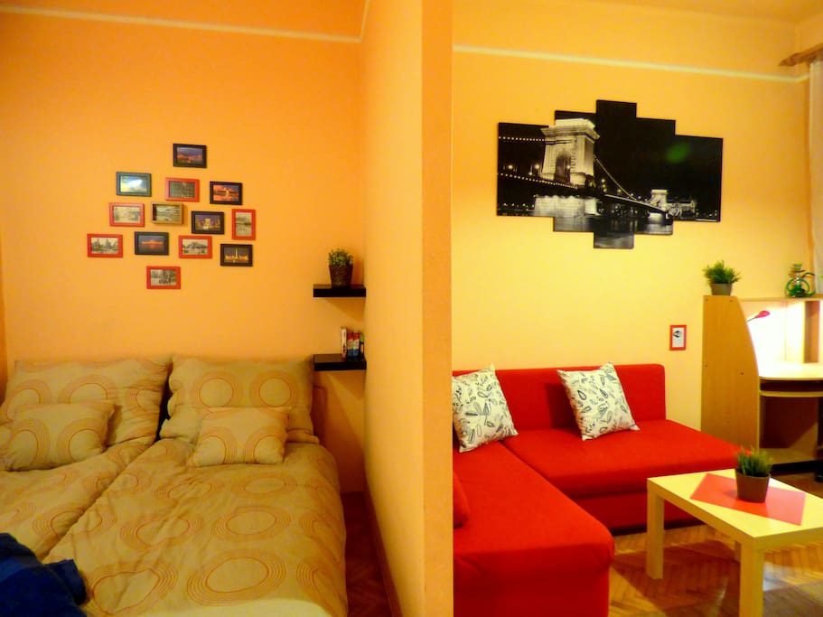 Bedroom and living room separated by a wall