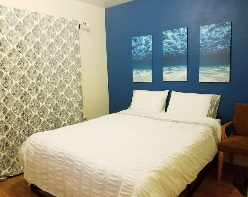 furnished bedroom with A/C and TV