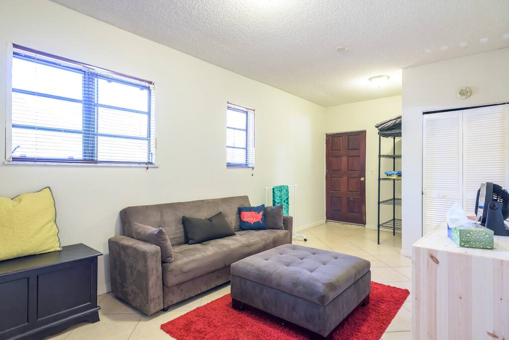 The futon sofa becomes a full size bed, the linens are kept underneath.