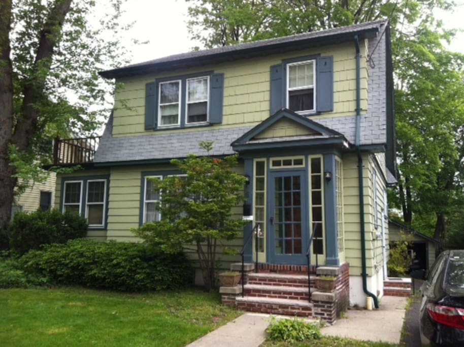 Front of house with driveway.