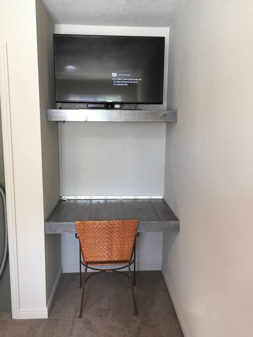 Built in desk and TV.