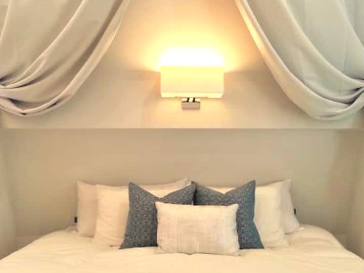 Primary bedroom with 2 singles as 1 King- hypoallergenic temperpedic like mattress. 