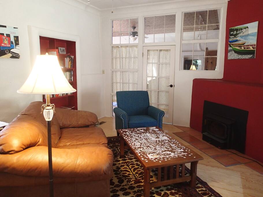 Cozy living room opens on to dining room and kitchen, perfect place to do a jigsaw puzzle.