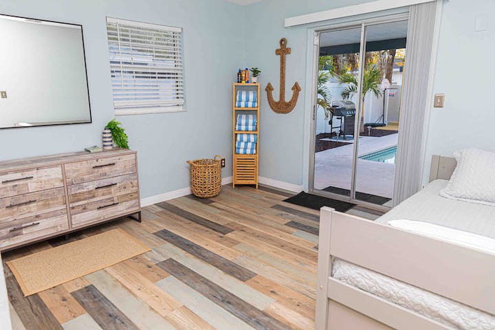 Bedroom 4 located in rear of house with access to the pool.  The room includes a twin size bed with a pull out trundle.