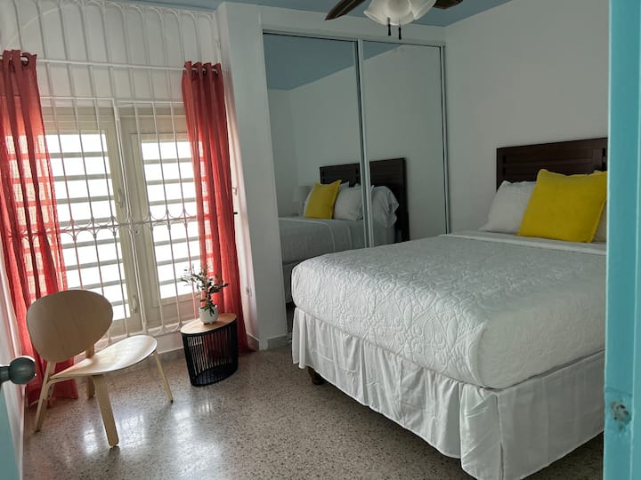 Spacious second bedroom has a very comfy queen size bed, split a/c unit,  ceiling fan and mirrored closet.