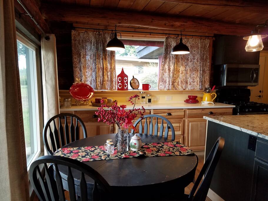 Kitchen table seats 4 and there are 2 bar stools