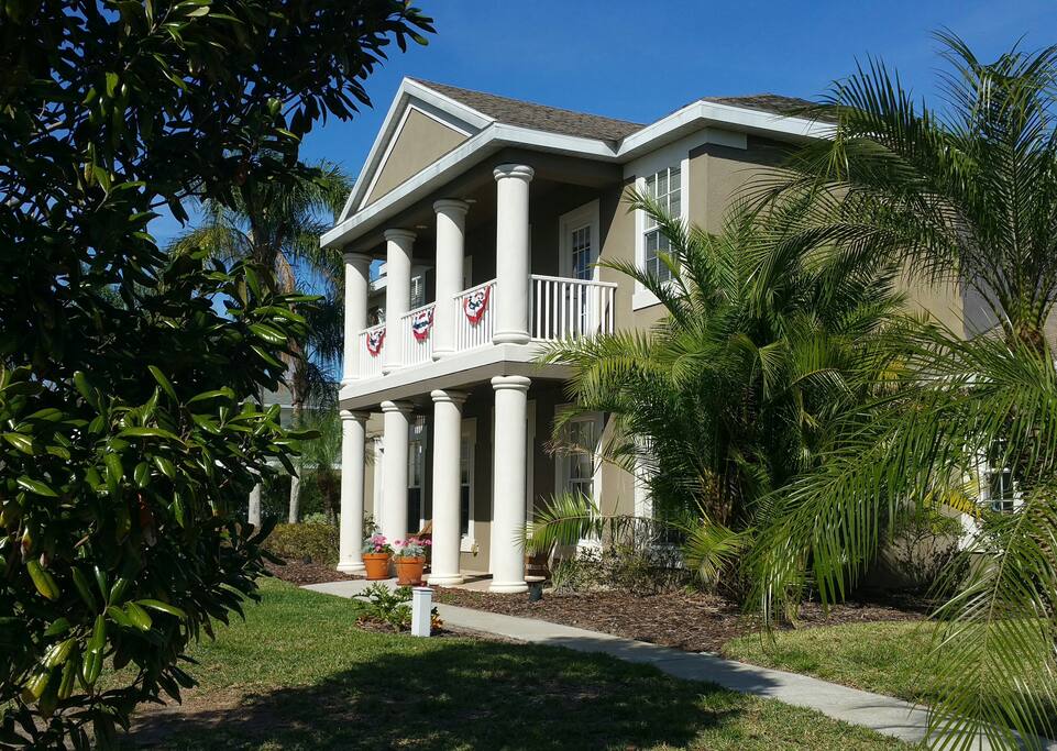 Porch rocking chairs. 2 entrances through front door and garage.