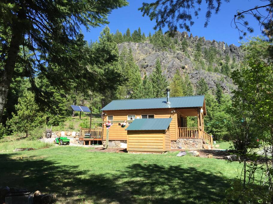 Side-view of the main cabin where you can see the solar array and the exquisite rock formations up Moose Canyon.