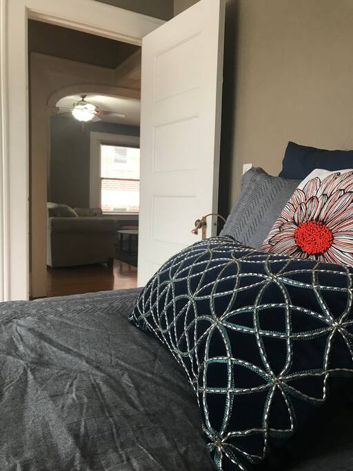 Large comfy bed beckons from living room
